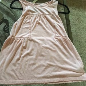 Pink top with designs across the shirt